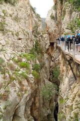 Province of Malaga, Andalusia, southern Spain. Unidentifiable visitors wearing helmets against...