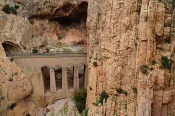 Vertical rock faces on the Kings Walkway or El Caminito del Rey in the province of Malaga,...