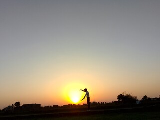 Fototapeta premium silhouette of a person on a bicycle