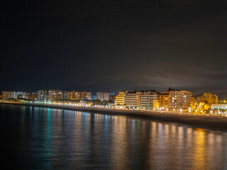 Blanes on the Costa Brava night photography, reflections of lights in the Mediterranean Sea if dark night