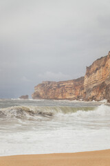 Dramatic Wave Crashing on a Sandy Beach