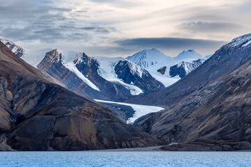 A hanging glaciers in the mountains of Kaiser Franz Joseph Fjord, Northeast Greenland National...