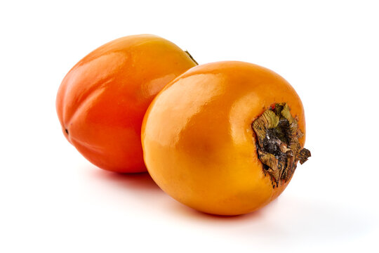 Fresh Ripe Persimmons, isolated on white background.