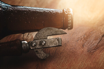 Vintage Bottle Opener and Brown Glass Bottle with Condensation