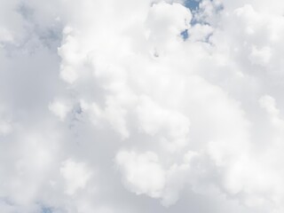 Fototapeta premium Soft and fluffy clouds filling the sky, creating a dreamy and calming texture, atmosphere, serene