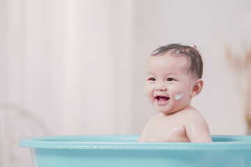 Asian children boy shower in bathroom. Funny little boy taking a bath.