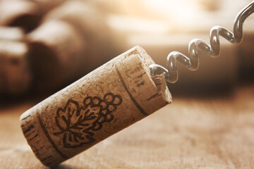 Wine Corks and Corkscrew on Wooden Table