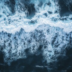 Fototapeta premium Aerial View of Ocean Waves Crashing, White Foam and Deep Blue Water