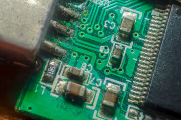 Close-up of a circuit board revealing intricate details and components. Ideal for...