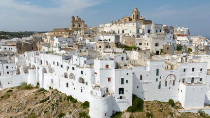 Aerial view of Old Town of Ostuni, in the province of Brindisi, in Puglia, Italy. Ostuni's citadel is commonly referred to as "the White Town" for the color of the historic center.