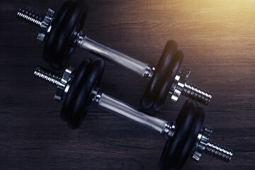 Fototapeta premium Black Dumbbell Against Dark Background