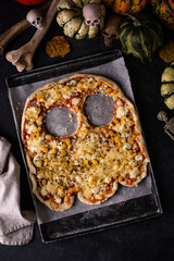 Halloween scary pizza in shape of ghost