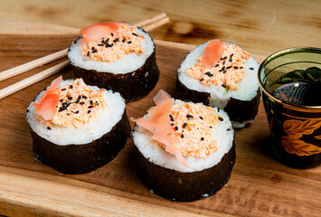 sushi on a black plate