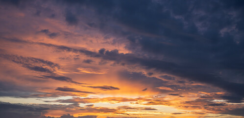Fototapeta premium Contrasting sky with clouds at sunset.