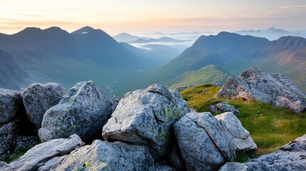 Expansive mountain view at dawn, soft light illuminating the rocky terrain, misty valleys, serene and untouched wilderness