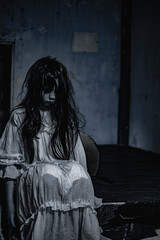 The spirit of a young woman who died in an abandoned hotel room with a sense of resentment