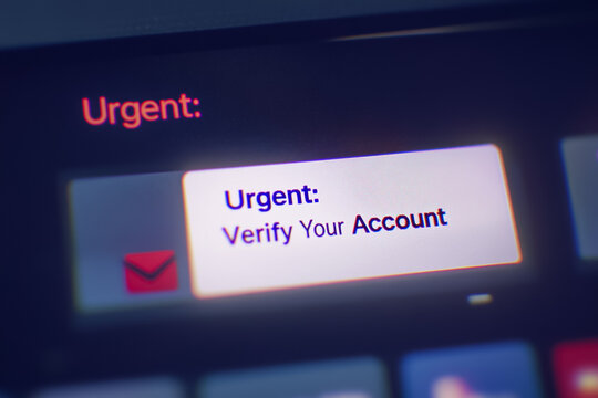 Close-up of a digital inbox filled with urgent-looking notification emails, highlighting words like Verify Account and Urgent. phishing attempts