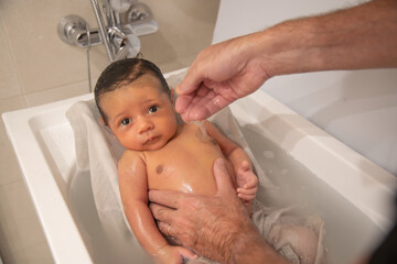Baby in the bathroom following his cleaning routine