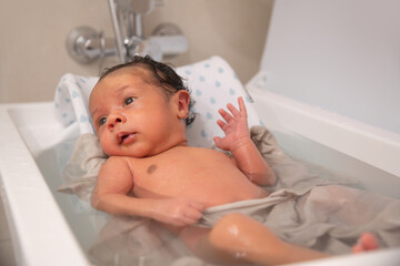 Baby in the bathroom following his cleaning routine
