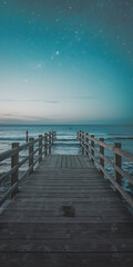 Obraz premium Wooden pier leading to the ocean under a starry teal sky perfect for travel and vacation designs 