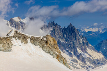 Snow covered mountains and rocky peaks of the Alps from the sky way between Chamonix and Courmayeur...