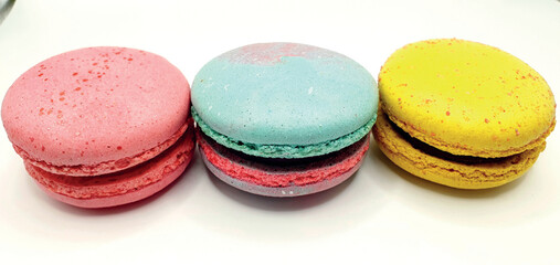 Delicious macaroon cakes isolated. Bright macarons vector background. Sweet background. Multi-colored round cookies and cakes. Bright background.