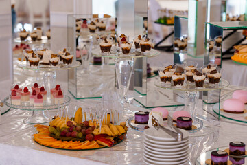 Exquisite Dessert Table Featuring an Array of Elegant Sweet Treats and Fresh Fruits