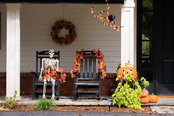 Various colorful Fall and Halloween yard and porch decorations