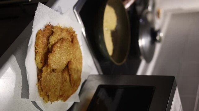 Potato food. Delicious golden draniki are cooked on a frying pan