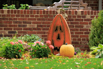 Various colorful Fall and Halloween yard and porch decorations