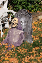 Various colorful Fall and Halloween yard and porch decorations
