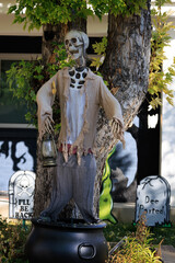 Various colorful Fall and Halloween yard and porch decorations