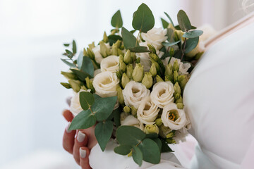 Elegant Bridal Bouquet of White Roses and Green Foliage