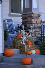 Various colorful Fall and Halloween yard and porch decorations