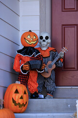 Various colorful Fall and Halloween yard and porch decorations