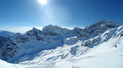 Obraz premium Snow-covered mountains, clear blue sky and crisp air
