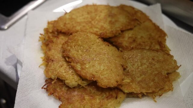 Potato food. Delicious golden draniki are cooked on a frying pan