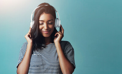 Woman, studio and headphones with happy music, listening and streaming podcast for calm with gen z....