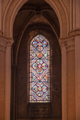 Detail of stained glass windows from Chartres cathedral in France, with its clock