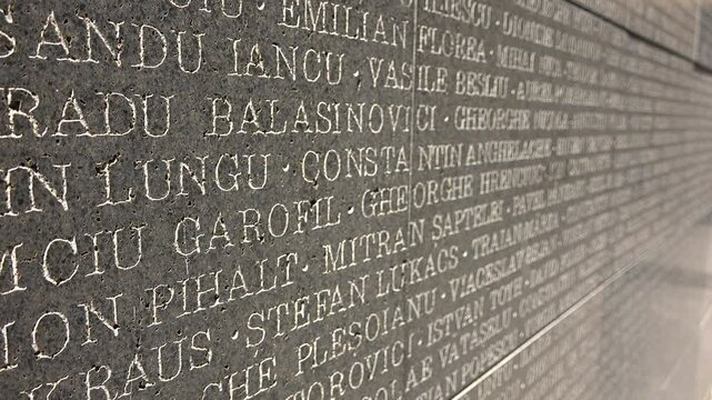 Sighetul Marmatiei, Romania - June 05, 2017: Communism victims names engraved in the wall of the old prison