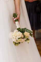 Elegant Bridal Bouquet Featuring White Flowers and Greenery