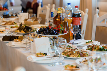 Lavish Banquet Table Set with Assorted Dishes and Beverages