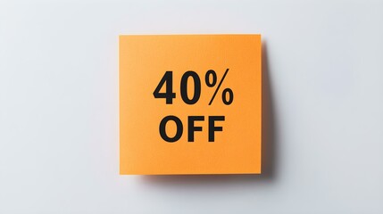 Naklejka premium Black '40% OFF' Text on a Light Orange Square Paper Note. White Background with Copy Space