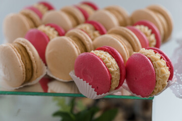 Delightful Assortment of Colorful Macarons Displayed Elegantly on a Glass Stand