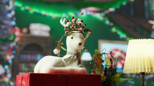 Empty cozy log cabin decorated with festive garlands and ornaments, quiet North Pole workshop where Santa and his elves working on making toys. Space with colorful decorations. Close up.