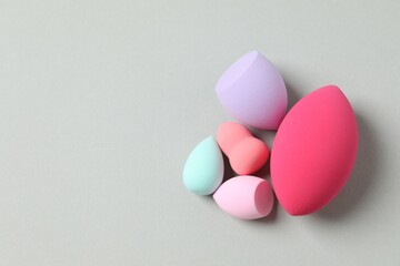 Beauty blender on a gray background. Bright sponges for make-up cosmetics. Make-up products. Beauty concept