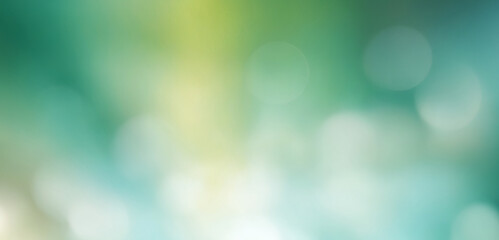 Obraz premium Colorful lights create an abstract blurred background, showcasing a shopping mall ambiance with bokeh and flare effects.