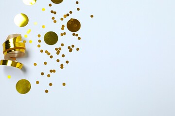 Beautiful shiny golden glitter on a white background, close-up