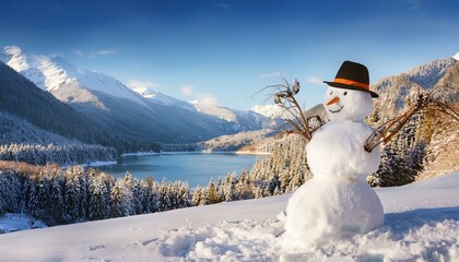 Fototapeta premium Snowman with Hat and Carrot on Snow in the Mountains and Lake