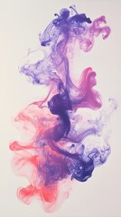 Obraz premium Colorful ink clouds blending in water with vibrant hues on white background, abstract art concept